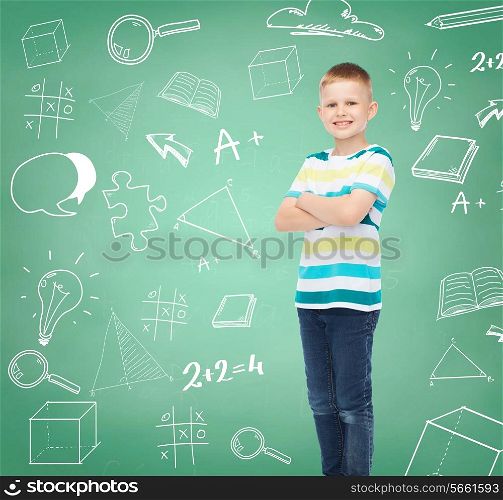 happiness, childhood, school, education and people concept - smiling little boy in casual clothes over green board with doodles background
