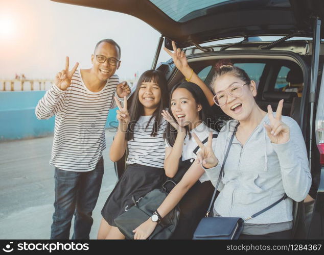happiness emotion of asian family taking a photograph at vacation traveling destination