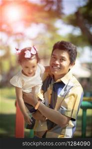 happiness emotion of asian father and daughter in green garden
