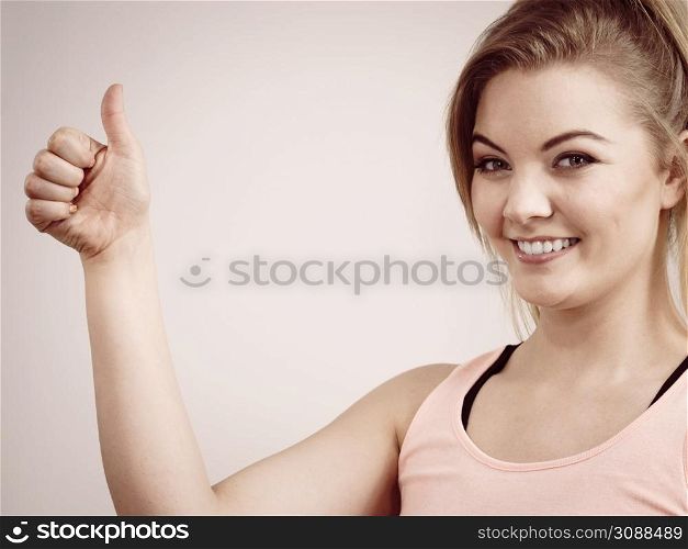 Happiness face expressions concept. Portrait of happy cheerful blonde woman smiling with joy showing thumb up gesture.. Portrait of happy blonde woman smiling with joy