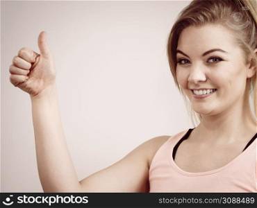 Happiness face expressions concept. Portrait of happy cheerful blonde woman smiling with joy showing thumb up gesture.. Portrait of happy blonde woman smiling with joy