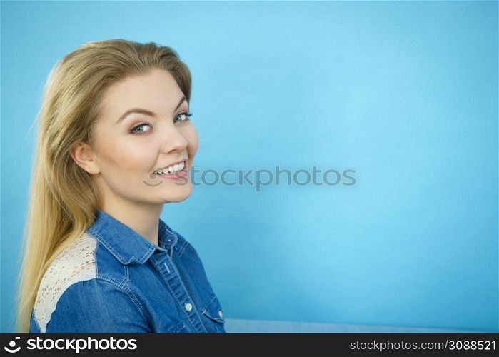 Happiness face expressions concept. Portrait of happy cheerful blonde woman smiling with joy wearing blue jeans shirt.. Portrait of happy blonde woman smiling with joy