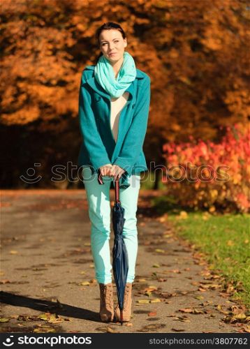Happiness freedom and people concept. Casual young woman teen girl walking relaxing with umbrella in autumnal park, outdoor