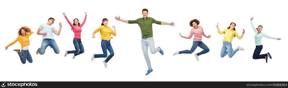 happiness, freedom, motion and people concept - smiling young international friends jumping in air over white background. happy people or friends jumping in air over white