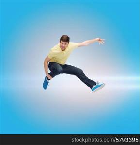 happiness, freedom, movement and people concept - smiling young man jumping in air over blue laser background