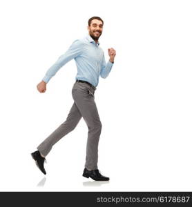 happiness, freedom, movement and people concept - smiling young man running away