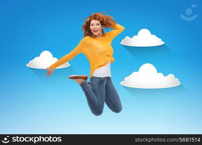 happiness, freedom, movement and people concept - smiling young woman jumping in air over blue sky with white clouds background