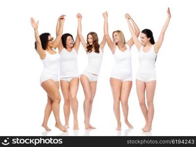 happiness, friendship, beauty, body positive and people concept - group of happy different women in white underwear with raised arms celebrating victory