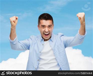 happiness, gesture, emotions and people concept - happy laughing man with raised hands over blue sky and cloud background
