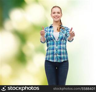happiness, gesutre and people concept - smiling young woman in casual clothes showing thumbs up over green background