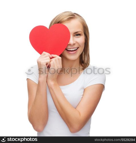 happiness, health and love concept - smiling woman in white t-shirt with covering half face with heart