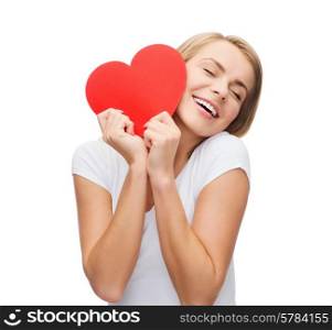 happiness, health and love concept - smiling woman in white t-shirt with heart