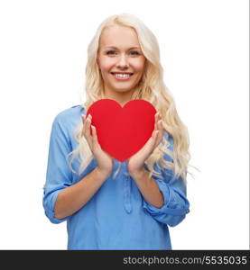 happiness, health and love concept - smiling woman with red heart