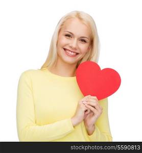 happiness, health and love concept - smiling woman with red heart