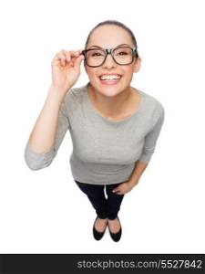 happiness, health and vision concept - smiling asian woman touching eyeglasses