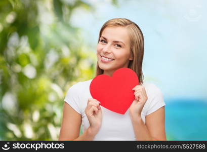 happiness, health, vacation and love concept - smiling woman in white t-shirt with heart