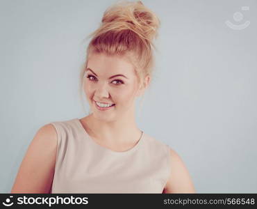 Happiness human face expressions concept. Happy positive cheerful smiling woman with blonde hair tied in bow. Happy positive smiling blonde woman