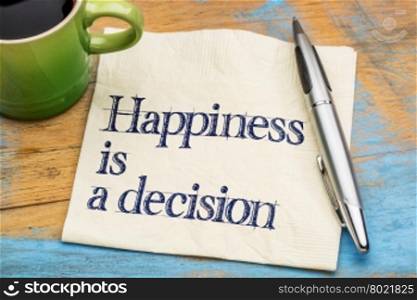 happiness is a decision - motivational phrase on a napkin with a cup of coffee