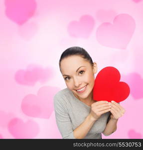 happiness, love and health concept - smiling asian woman with red heart