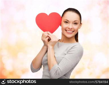 happiness, love and health concept - smiling asian woman with red heart