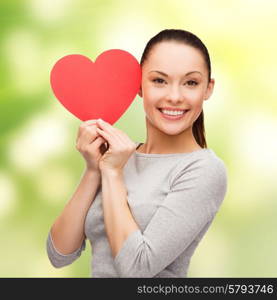 happiness, love and health concept - smiling asian woman with red heart