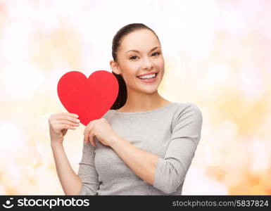 happiness, love and health concept - smiling asian woman with red heart
