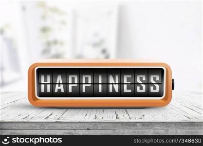 Happiness message on a retro alarm clock in a bright room with flowers