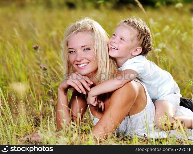 Happiness of the mother and daughter - people on nature