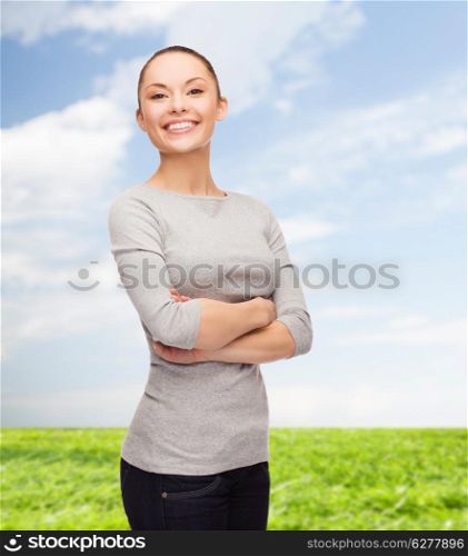 happiness people concept - smiling asian woman with crossed arms over white background