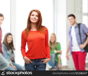 happiness, school, education and people concept - smiling teenager in casual top and jeans at school