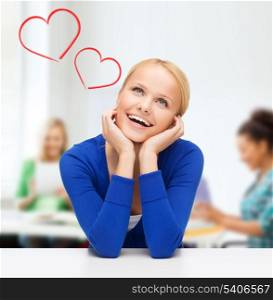 happiness, school, love and people concept - happy smiling young woman dreaming and laughing