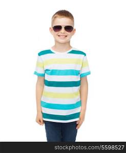 happiness, summer and people concept - smiling cute little boy in sunglasses