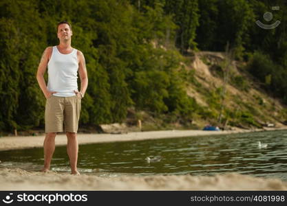 Happiness summer vacation and people concept. Fashion portrait handsome man full length on the beach landscape