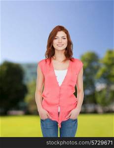 happiness, summer vacation and people concept - smiling teenage girl in casual clothes over park background