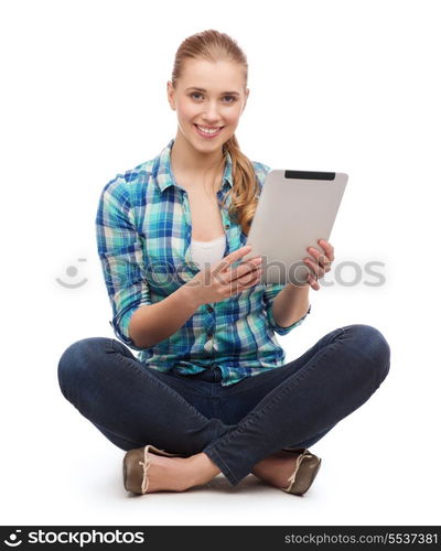 happiness, technology, internet and people concept - smiling young woman in casual clothes sitiing on floor with tablet pc computer