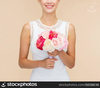 happiness, wedding, holidays and celebration concept - smiling bride or bridesmaid in white dress with bouquet of flowers