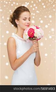 happiness, wedding, holidays, people and celebration concept - smiling woman in white dress with bunch of flowers over beige background and snow