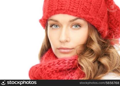 happiness, winter holidays, christmas and people concept - close up of smiling young woman in red hat, scarf and mittens over white background