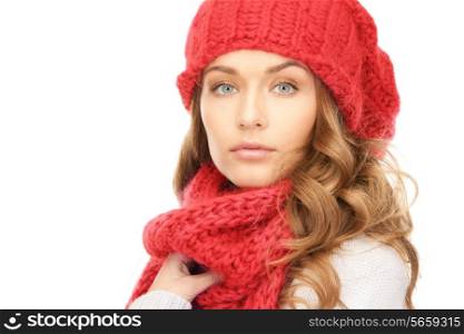 happiness, winter holidays, christmas and people concept - close up of smiling young woman in red hat, scarf and mittens over white background