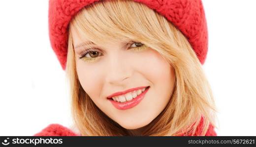 happiness, winter holidays, christmas and people concept - close up of smiling young woman in red hat and scarf over white background
