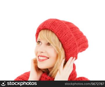 happiness, winter holidays, christmas and people concept - young woman in pink hat and scarf over white background
