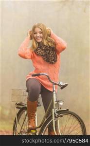 Happy active woman riding bike in autumn park.. Happy active woman riding bike bicycle in fall autumn park. Glad young girl relaxing. Healthy lifestyle..