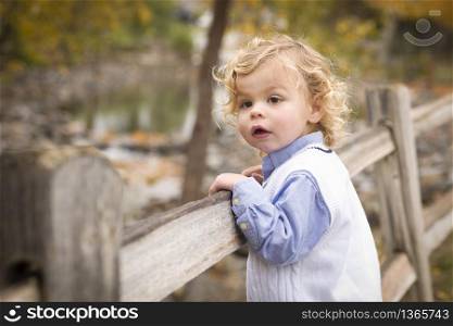 Happy Adorable Young Blonde Boy Playing Outside.