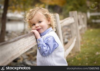Happy Adorable Young Blonde Boy Playing Outside.