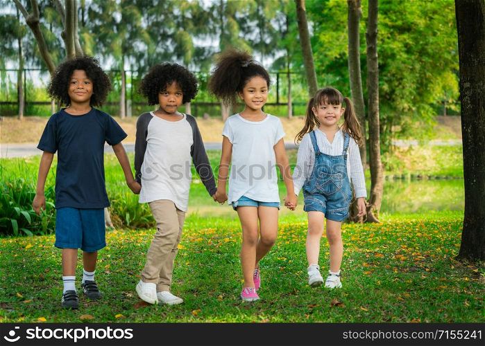 Happy African American boy and girl kids group playing in the playground in school. Children friendship and education concept.