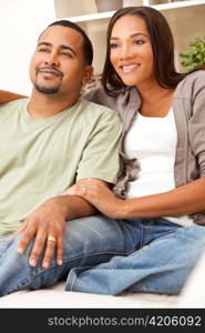 Happy African American Couple Sitting At Home