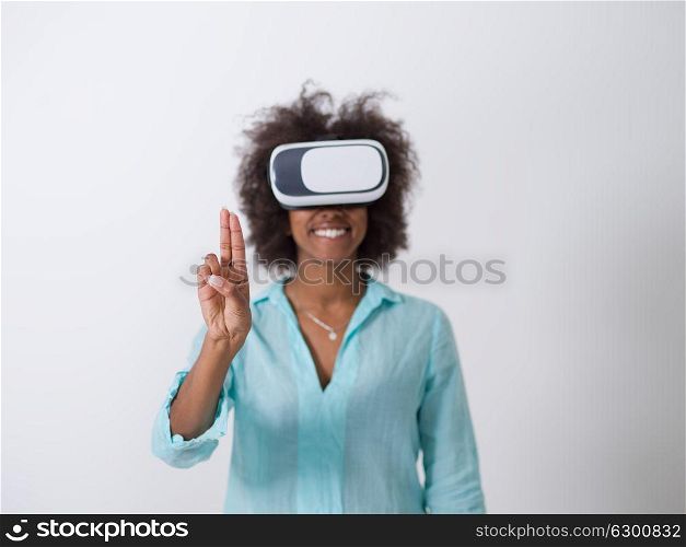 Happy african american girl getting experience using VR headset glasses of virtual reality, isolated on white background