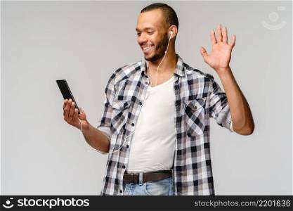 Happy african american man using mobile phone for video call.. Happy african american man using mobile phone for video call