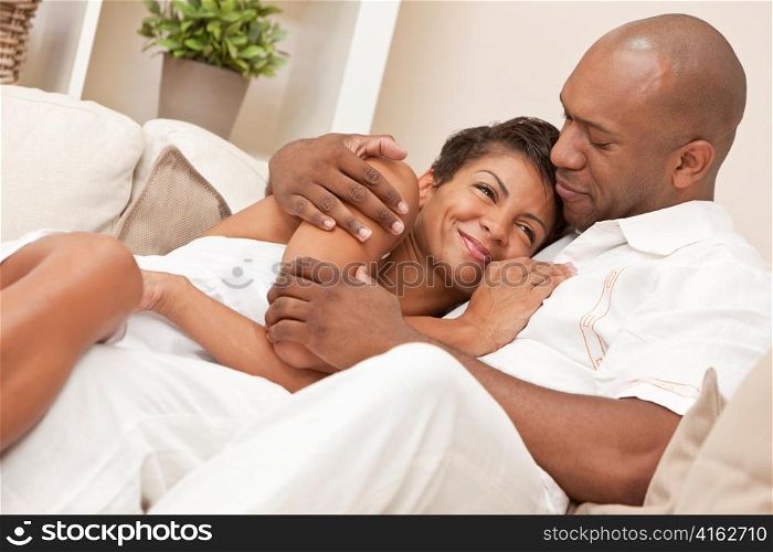 Happy African American Man & Woman Couple Embracing
