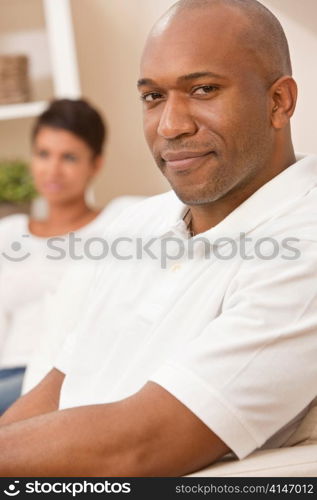 Happy African American Man Woman Couple Sitting At Home